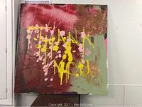 Full view of the 35x35 inch square abstract mixed media painting on canvas, showing multi-colored textured layers predominantly in maroon, light green, yellow, pink, and white.