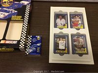 Photo showing 1991 NASCAR card collection box, smaller update card set box, and four cards displayed with names Larry Mcreynolds, Mark Martin, Waddell Wilson, Robert Pressley