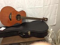 Full view of Yamaha APX-3 acoustic-electric guitar with hard-shell case