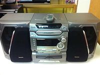 Full view of Panasonic stereo system with speakers and remote on top