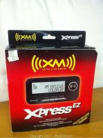 Front of the XM Satellite Radio Xpress EZ box showing the device and branding.