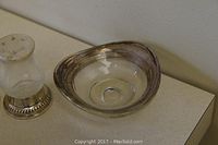 Photo showing the small glass vase with sterling silver base and the sterling silver bowl.