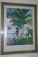 Large framed tropical themed print showing a car's rear fins and palm tree in the background