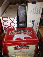 Photo of red metal box labeled Williams-Sonoma Animal Cookie Cutters with animal illustrations and list of included animals.