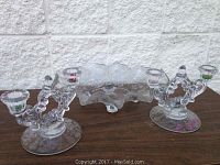 Wide view of the set: etched floral glass bowl and two glass candle holders with two arms each