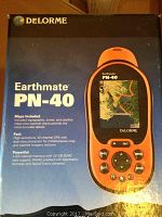 Photo of the original box of the DeLorme Earthmate PN-40 GPS showing device and key product features.