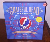 Closed view of the Grateful Dead Scrapbook showing the cover design with the skull logo and title.