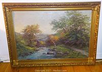 Full front view of oil painting and gilded frame