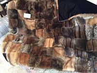 Full view of patchwork fur throw spread out