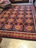 Full view of wool area rug on floor