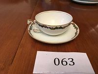 Cup and saucer set side view showing shape and pattern