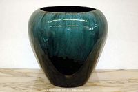 Front view of the 13-inch Blue Mountain Pottery vase showing green and blue drip glaze over black base