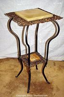 Full view of two-tier brass plant stand showing overall structure and height