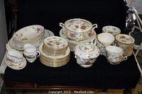 Full spread of Paragon Ceres pieces on a black cloth backdrop: plates, cups, saucers, tureen, teapot, sugar bowl, gravy boats and platters.