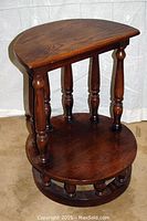 Side angle view of solid oak prayer stool showing turned spindle legs and solid wood surfaces.
