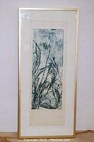 Full view of the framed woodblock print featuring tall slender plants with a textured background.