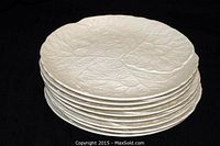 Stack of eight white Minton cabbage leaf plates