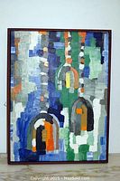 Full view of framed abstract oil painting with bold colors and thick brush strokes