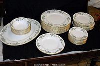 Full set arranged showing platter, stacks of plates and bowls