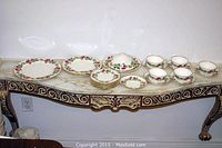 All pieces displayed on marble‐top console