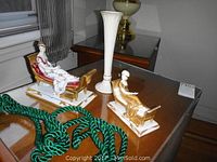 Pair of Madame Recamier figurines and Lenox bud vase on wooden table