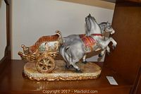 Front and side view of the porcelain two horse chariot on shelf