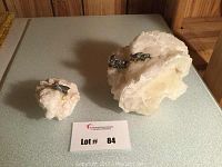 Photo showing both large and small crystal rock decor items on a display table.