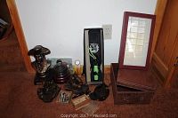 Wide shot showing the entire lot, including the bust, knife in box, bookends, and smaller items around them.