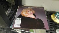 Joan Rivers vinyl record titled 'What becomes a Legend most?' showing cover art with Joan Rivers portrait.