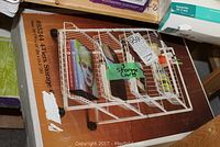 Box with image and label showing 4-tier metal storage cart with castors, dimensions 20x15x29.5 inches, white coated metal, labeled '3 Storage Carts'.