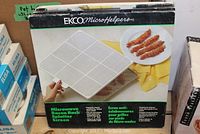 Boxed EKCO MicroHelpers Microwave Bacon Racks with splatter screens shown on front of box