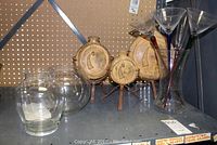 Photo of 8-inch clear crystal bowl, three-piece ceramic and metal decorative flasks set, glass carafe, and three long stemmed glasses (two martini and one champagne).