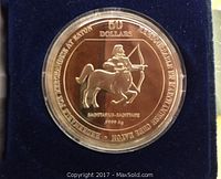 Reverse side of the coin showing Sagittarius centaur archer and inscriptions indicating purity, face value $50
