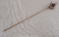 Full view of the Masonic stick pin showing the entire length and emblem head.