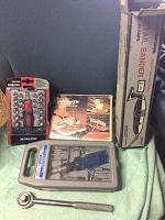 Tools from front showing WORKPRO ratchet screwdriver set, boxed DETAIL SANDER, Craftmate utility jigsaw, and Blue Point ratchet and bits.