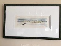 Full view of the framed winter landscape print showing the scene of two figures dragging a Christmas tree through snowy fields.