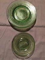 Top-down view showing one larger plate and one smaller plate, highlighting textured pattern and starburst base