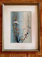 Full view of framed watercolor painting depicting flowers on stems, soft colors with gold frame and cream matting.