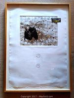 Full view of framed embossed artist proof print on paper with abstract design and embossed artist seals.