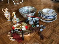 Wide view showing all items in the lot on wooden floor