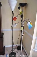 Photo showing all three floor lamps grouped together, highlighting varying heights and colorful shades.