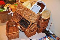 Overall stack of multiple wicker baskets in various sizes and colors