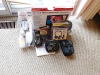 Full lot view showing GPX 13 inch HDTV box, two Panasonic cordless phones with base, CTEK wireless headphones, and SteamBuddy steamer.