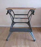 Front view of the Black & Decker Workmate folding workbench showing wooden top and metal frame.