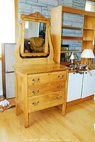 Full front view of dresser with attached mirror showing finish and overall structure