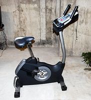 Side profile of the entire bike showing frame, seat and base