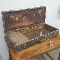 Open antique carpenter box showing interior compartments and original hardware on lid
