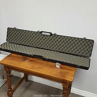 Open Hoppe's Protecto gun case showing the interior egg-crate foam padding designed to protect firearms or similar items.