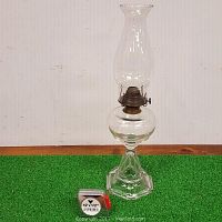 Full view of the 16-inch tall clear glass oil lamp with pie crust chimney, placed next to a measuring tape for scale.