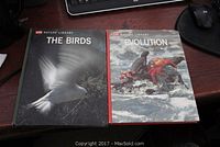 Photo of Life Nature Library books: The Birds and Evolution volumes with photographic covers featuring birds and a crab on water, respectively.